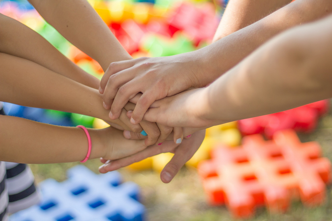 Female hands supporting each other