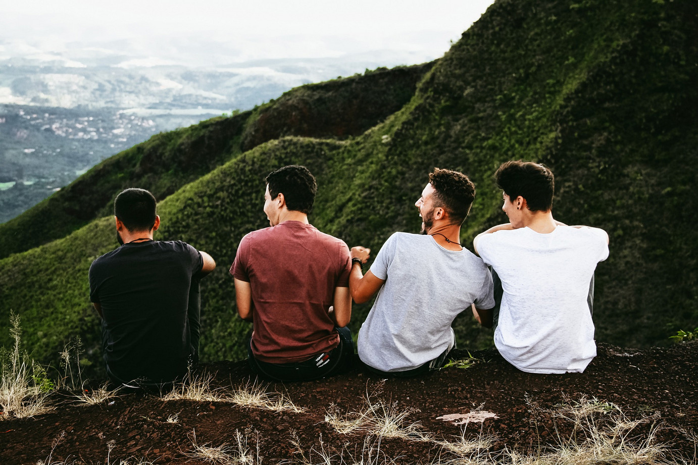 Group of men sitting together